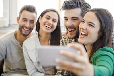 Four people taking a selfie