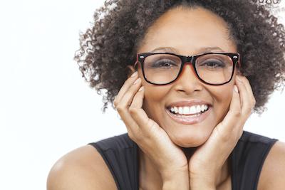 woman smiling after getting cosmetic dentistry